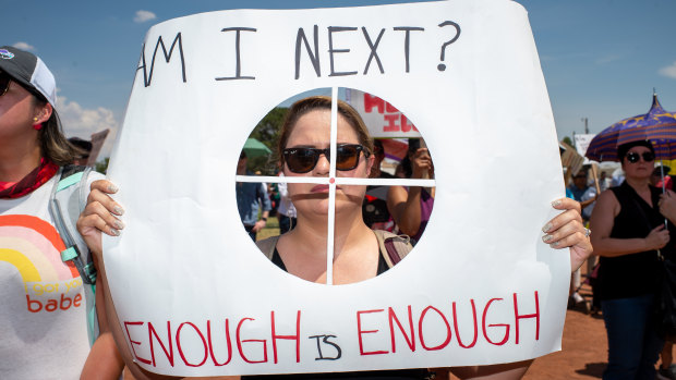 A demonstrator holds a sign in El Paso, Texas.