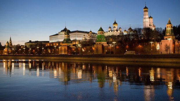 The Moskva River flows past the fortified outer walls of the Kremlin complex in Moscow, Russia.