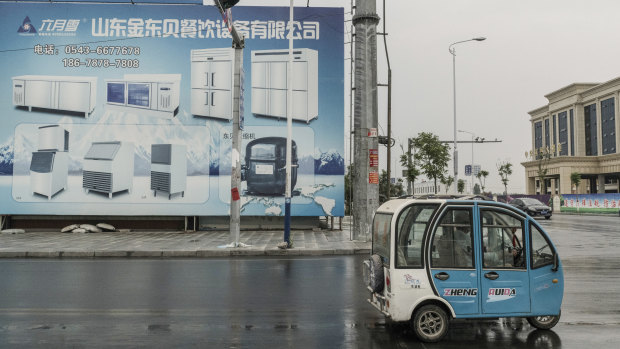 A billboard advertises refrigerators from a local factory on a street in Xingfu, China.