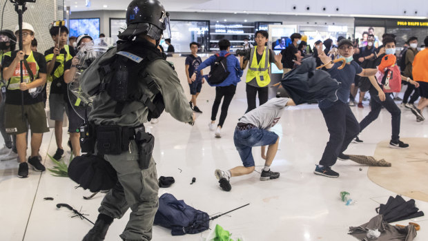 Riot police clashes with demonstrators inside New Town Plaza shopping mall in the Sha Tin district of Hong Kong, China.
