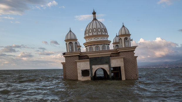 A mosque is surrounded by water in Palu, Central Sulawesi, on Tuesday after the earthquake and tsunami there.