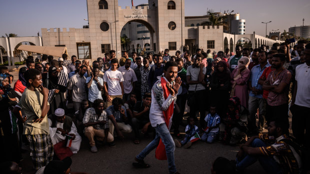 An activist addresses a gathering crowd during a sit-in near one of the gates to Sudan’s military headquarters in Khartoum before this week's violence.