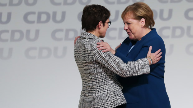 Angela Merkel, right, congratulates Annegret Kramp-Karrenbauer on becoming the head of Germany's ruling party last year.