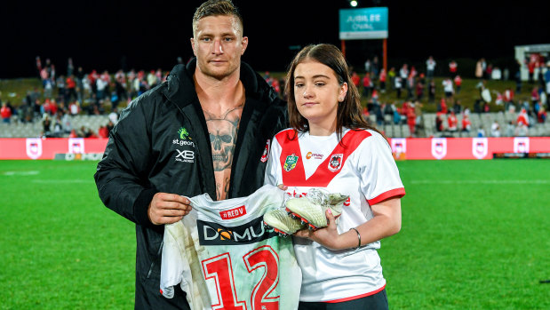 Tariq Sims presents match jersey to Shalisse Thompson,  the daughter of late Dragons and Sharks forward Lance Thompson.