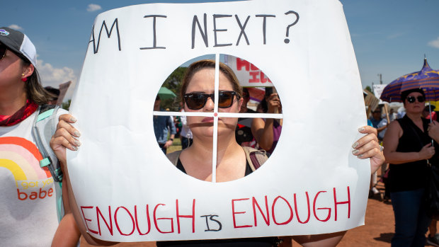 A demonstrator holds a sign in El Paso, Texas.