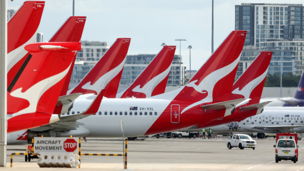Qantas will suspend international flights and temporarily stand down two-thirds of its workforce from the end of March.