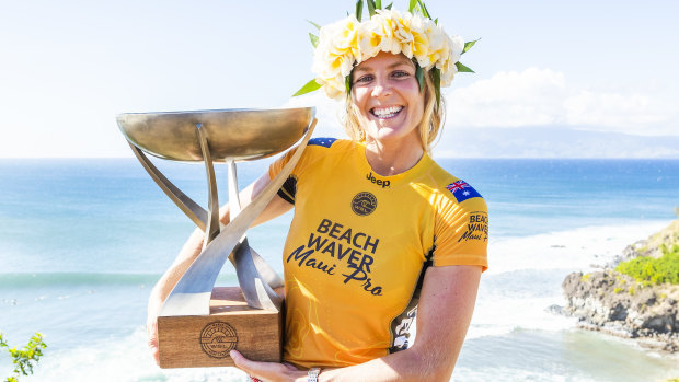 Spoils of victory: Stephanie Gilmore celebrates her record-equalling seventh world championship.