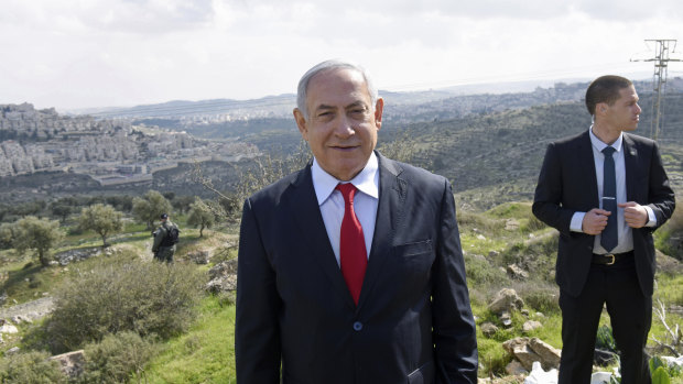 Israeli Prime Minister Benjamin Netanyahu stands at an overview of the Israeli West Bank Israeli settlement of Har Homa where on Thursday he announced a new Israeli neighbourhood is to be built.