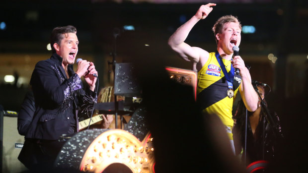 A more popular choice: Jack Riewoldt gets on stage with The Killers after 2017 grand final at the MCG.