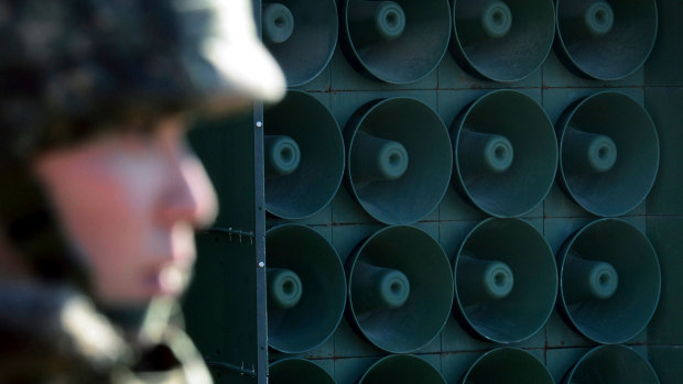 A South Korean army soldier stands near the loudspeakers near the border area between South Korea and North Korea in Yeoncheon, South Korea..