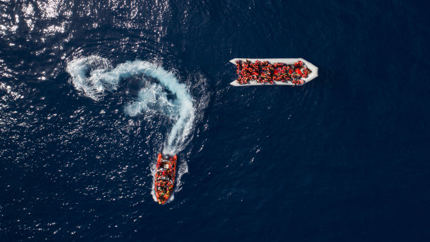 People are rescued by the Spanish NGO Proactiva Open Arms, after leaving Libya trying to reach European soil aboard an overcrowded rubber boat last month.