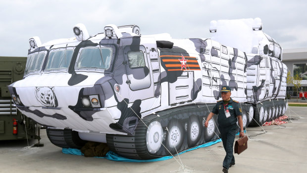 A visitor walks past an inflatable model of a TOR-M2DT Arctic short-range air defence missile system at the Army 2018 expo in Kubinka, Russia.