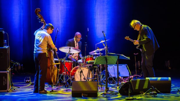 The Bill Frisell Trio, with Thomas Morgan (bass) and Rudy Royston (drums) .