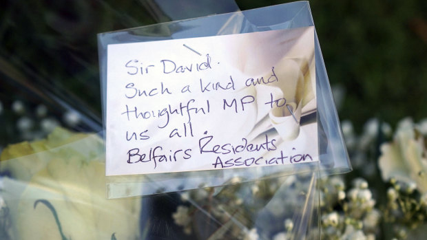 Flowers are laid near the Belfairs Methodist Church where British MP David Amess was killed. 