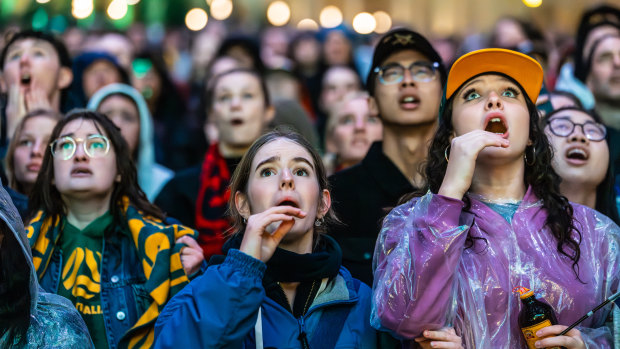 Matildas supporters watch on from Melbourne’s Federation Square.
