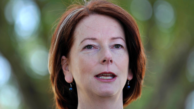 "While we cannot fully erase the pain of the past, we can help to ease its burden": Former prime minister Julia Gillard.