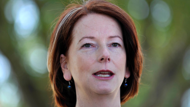 "She grunted her assent": Mr Rudd says Julia Gillard, then his deputy, begrudgingly supported the government's action against the forgery.