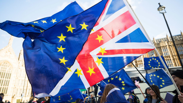 Brexit protesters wave flags made up of a European Union flag and a Union Jack, in London, in January.