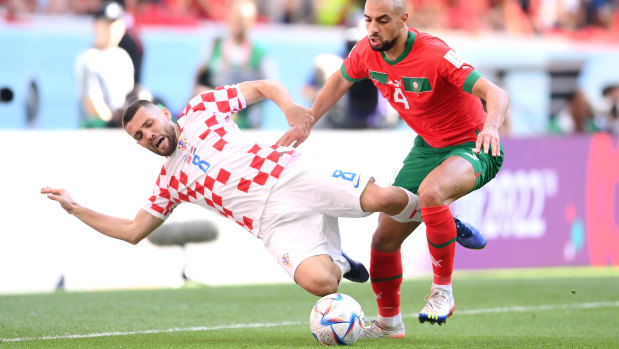 Mateo Kovacic of Croatia and Sofyan Amrabat of Morocco battle for the ball.