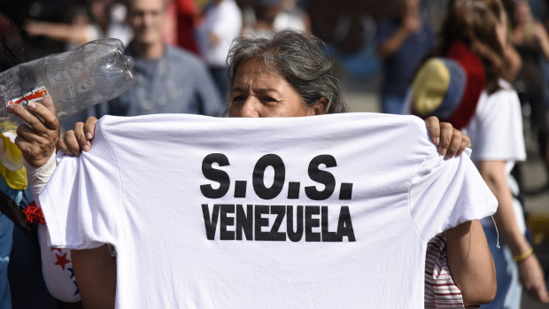 A participant holds a T-shirt during a protest against Venezuelan President Nicolas Maduro in Caracas, Venezuela, last week.