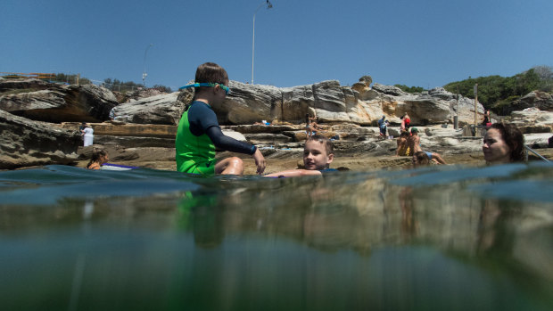 Iggy Wiseman, 7, and brother Jet, 5 (in green), at Mahon Pool.