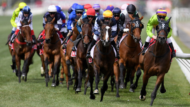 Race leaders Cismonte (right), Boomtime (second right) and Gallante (centre) pass the finish post on the first lap during the Melbourne Cup at Flemington Racecourse in Melbourne, Tuesday, November 7, 2017.