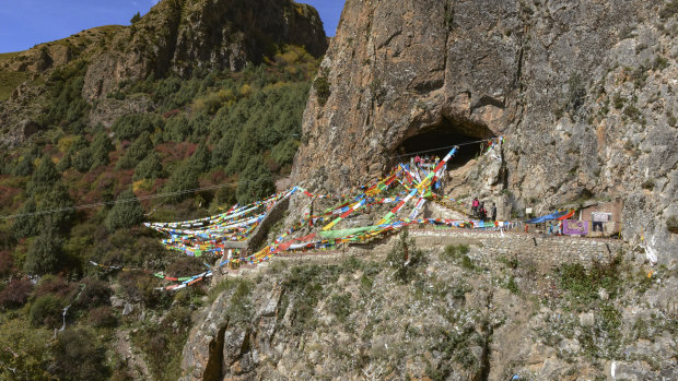 The Baishiya Karst Cave above the Jiangla riverbed in the Gansu province of China where the jawbone fragment was found.