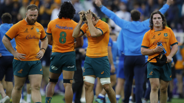 Wallabies players after their one-point defeat to Italy.