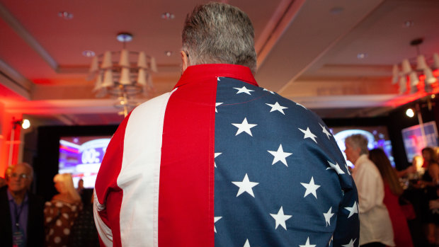 An attendee wears an American flag themed shirt during an election night rally for Rick Scott, winning Republican governor of Florida.