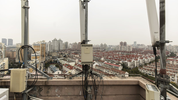 Huawei signal-transmission equipment stands on a building rooftop in Shanghai. China's largest technology company denies committing the alleged charges.