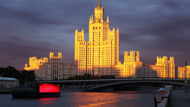 Cruise boats sail along the Moscow river near the Kotelnicheskaya embankment building. Trump has always wanted to have his name in lights in Moscow.