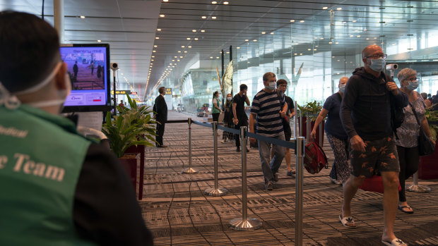 Passengers arrive at Singapore's Changi Airport. 