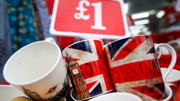A souvenir shop displays mugs with Union Jacks. Britain's retail sector may be disrupted by a hard Brexit.