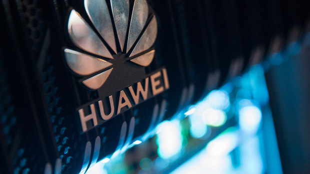 A corporate logo sits on a Huawei Technologies router at a 5G event in London, UK. 