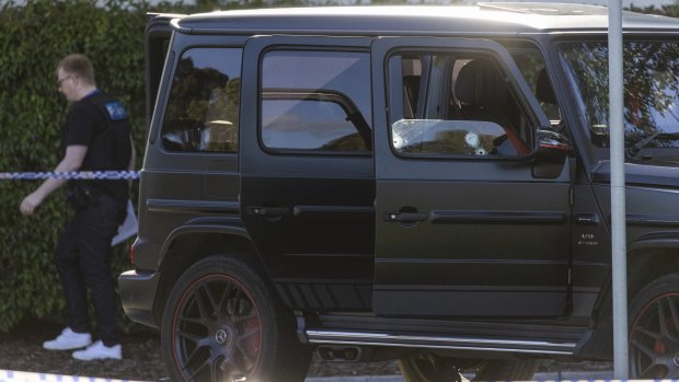 The black Mercedes outside Fawkner police station with three bullet holes in the driver’s side window.