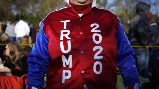 An attendee wearing a "TRUMP 2020" jacket waits in line to enter a rally with President Trump, not pictured, earlier this week in Kentucky.