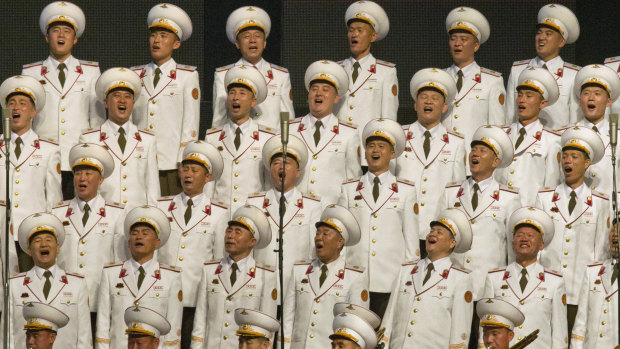 North Korean military choir members sing during an evening gala on Saturday.