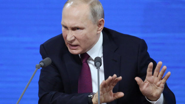 Vladimir Putin speaks at his annual press conference in Moscow.