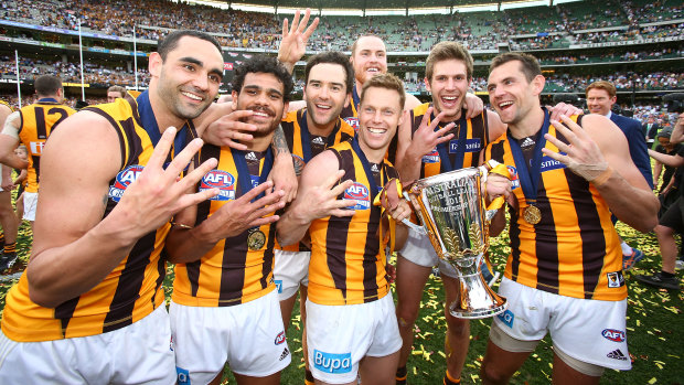 Shaun Burgoyne (left) with his Hawks teammates after the 2015 grand final win over West Coast. Burgoyne is nearing his 400th game.