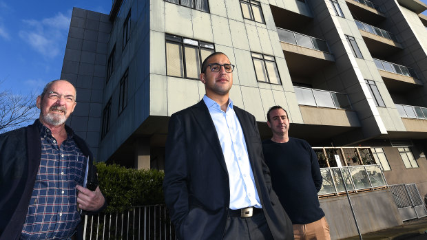 Apartment owners Brian Skirving, Reymon Makkar and Trent outside their St Kilda building. 