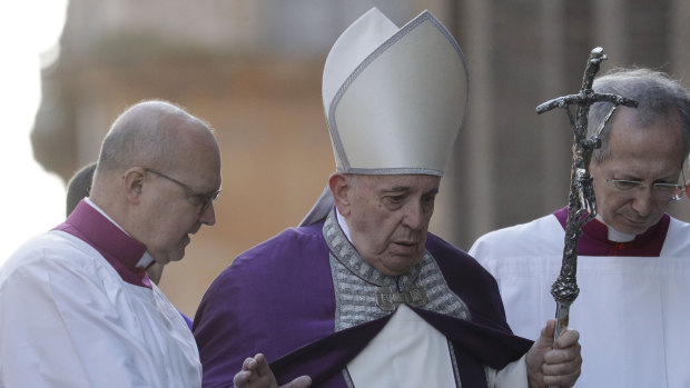 Pope Francis walks in procession to the Basilica of Santa Sabina before the Ash Wednesday Mass.