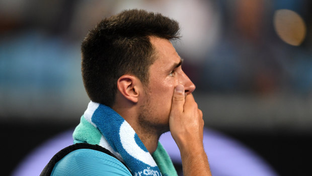 Walking the walk: Bernard Tomic makes his customary early exit from the Australian Open.