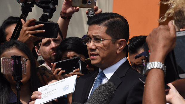 Mohamed Azmin Ali has been accused of appearing in a leaked sex tape - a claim he denies. 