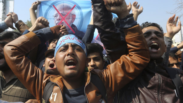 Supporters of Pakistani religious group Islami Jamiat-e-Talaba chant slogans at a rally against India on Wednesday February 27.