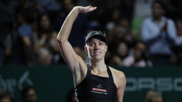 Gritty: Angelique Kerber celebrates after securing her first win of this year's WTA Finals.