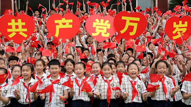 Students celebrate the 100th anniversary of the Party in Shandong Province, China in June. 
