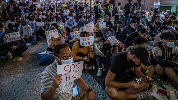 With the Polytechnic Uni under siege, people protest in the popular tourist district of Tsim Sha Tsui.  