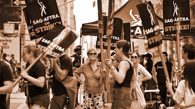 Actor Susan Sarandon, centre, joins a picket line outside the offices of Netflix and Warner Bros in New York City on July 19.