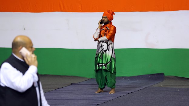 A supporter takes time out during a rally for Rahul Gandhi in New Delhi in March.