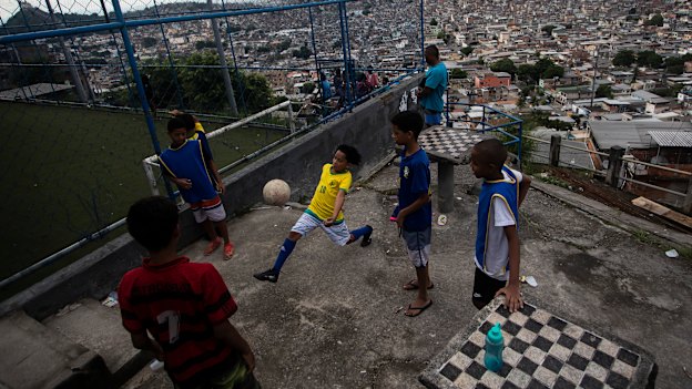 Boys playing soccer in a favela in Rio de Janeiro